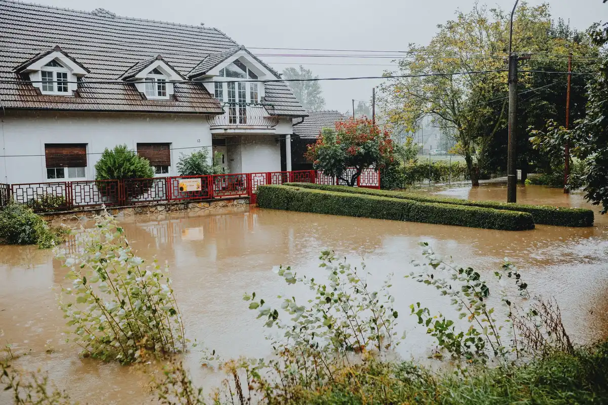 Residential area showing flood damage and debris from severe weather