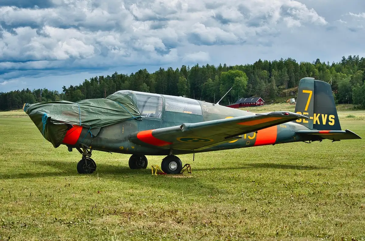 Ruined military aircraft debris on tarmac after attack